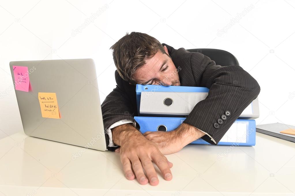 young tired and wasted businessman working in stress at office laptop computer sleeping exhausted