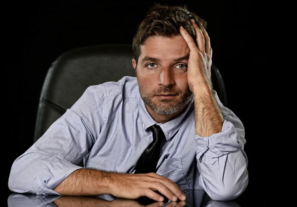 Young attractive businessman in worried tired and stressed face expression sitting depressed on office chair — Zdjęcie stockowe