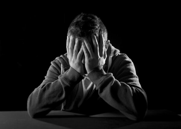 desperate man suffering emotional pain, grief and deep depression