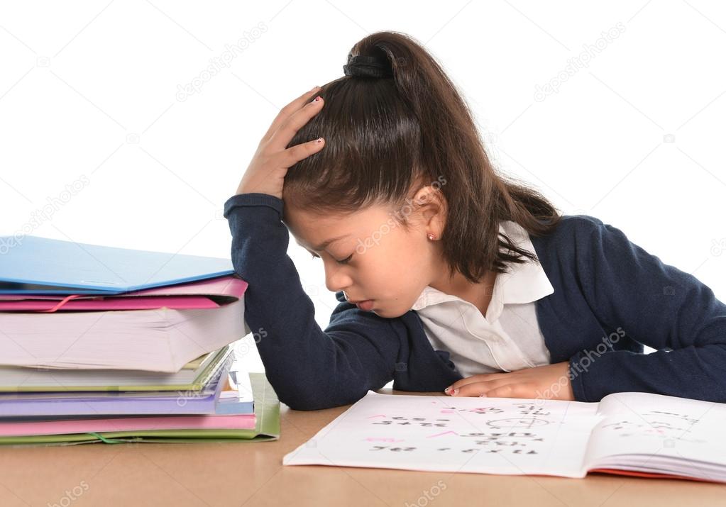 kid bored under stress with a tired face expression in hate homework concept