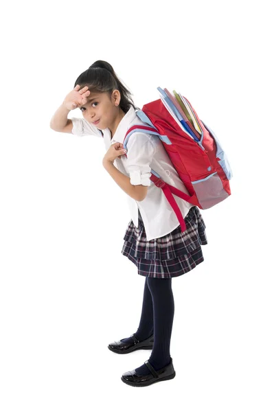 Sweet little girl carrying very heavy backpack or schoolbag full — Stock Photo, Image