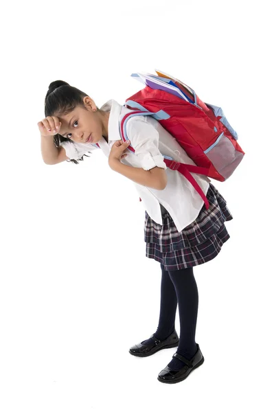 Sweet little girl carrying very heavy backpack or schoolbag full — Stock Photo, Image