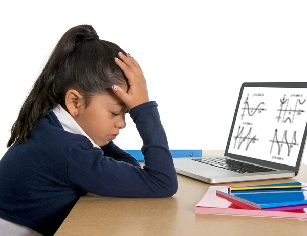 Spanish little schoolgirl bored and tired with computer maths homework — Stock Photo, Image