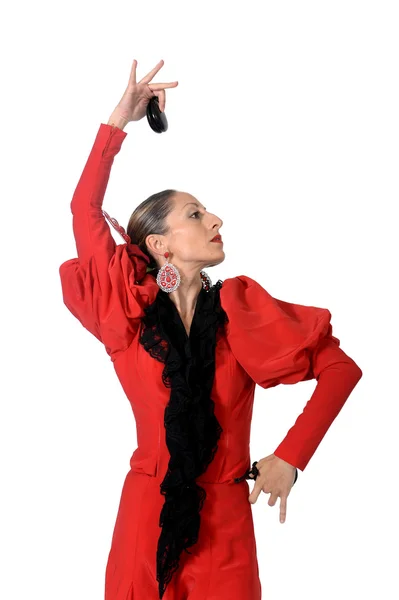 Jonge Spaanse vrouw flamenco dansen met castagnetten in haar handen — Stockfoto