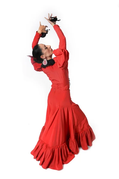 Jonge Spaanse vrouw flamenco dansen met castagnetten in haar handen — Stockfoto