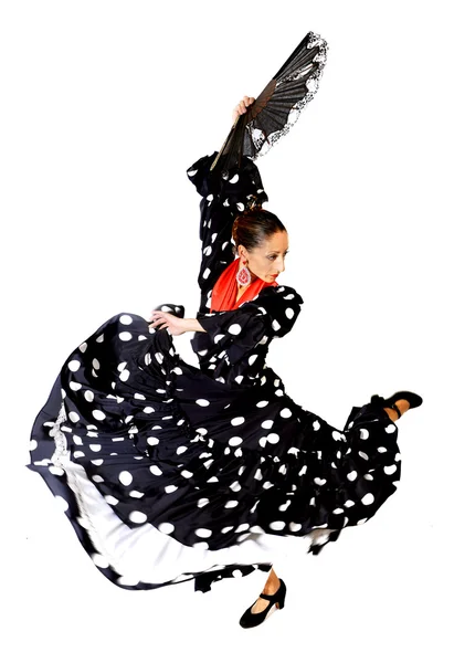 Mujer española bailando Sevillanas con abanico y típico folk negro con vestido de lunares blancos — Foto de Stock