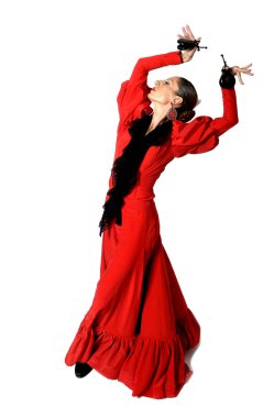 young Spanish woman dancing flamenco with castanets in her hands clipart