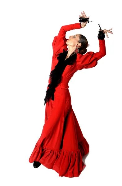 Jonge Spaanse vrouw flamenco dansen met castagnetten in haar handen — Stockfoto