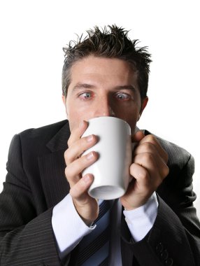 addict business man in suit and tie drinking cup of coffee anxious and crazy in caffeine addiction clipart
