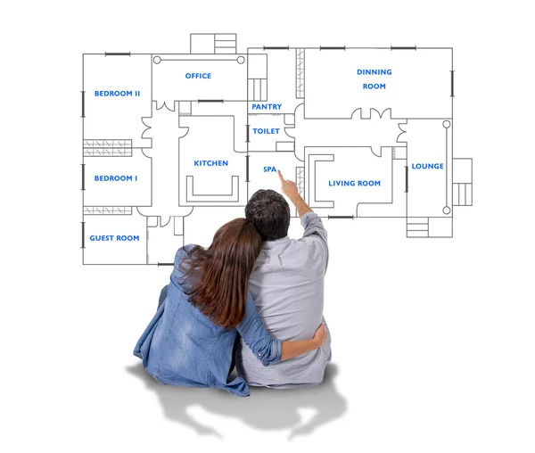 Young couple dreaming and imaging their new house in real state concept — Stock Photo, Image