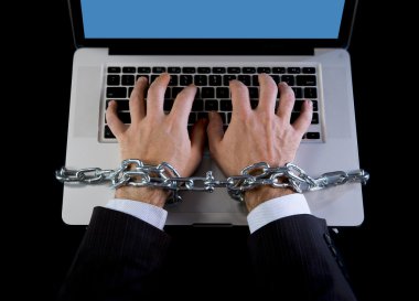 Hands of businessman addicted to work bond with chain to computer laptop in workaholic clipart