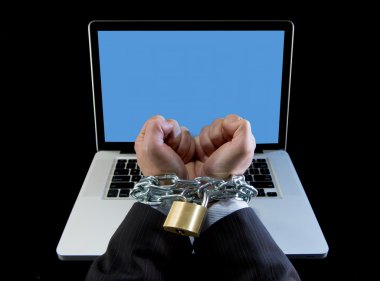 Hands of businessman addicted to work bond with chain to computer laptop in workaholic clipart
