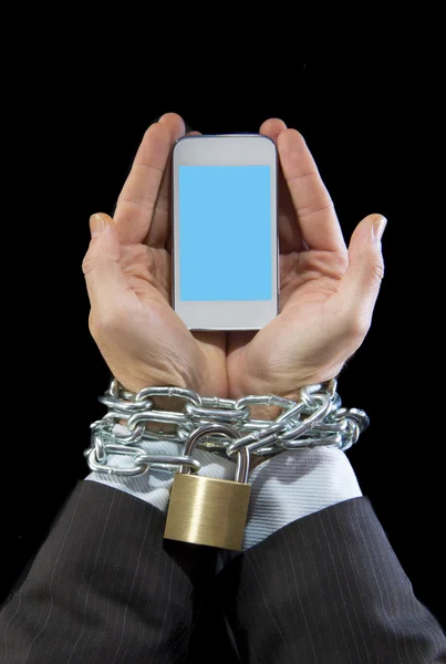 Hands of businessman addicted to work locked and enchained in mobile phone addiction — Stock Photo, Image