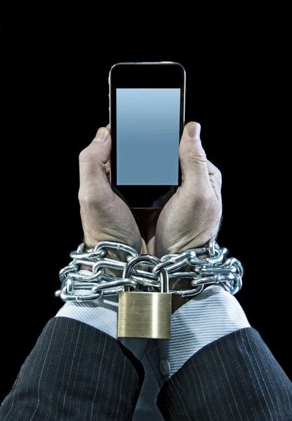 Hands of businessman addicted to work chain locked in mobile phone addiction — Stock Photo, Image