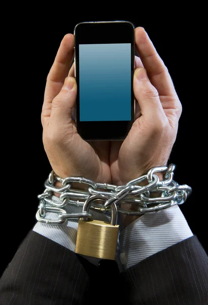 Hands of businessman addicted to work chain locked in mobile phone addiction — Stock Photo, Image