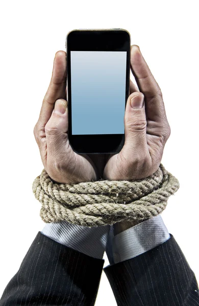 Hands of businessman addicted to mobile phone rope bond wrists in smartphone internet addiction — Stock Photo, Image