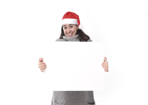 Young sweet Latin woman in Santa Christmas hat holding blank bil — Stock Photo, Image