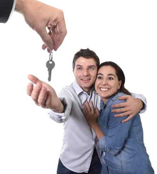 Young happy couple receiving house key new residence in real state concept — Stock Photo, Image