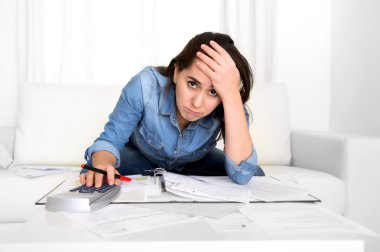 young woman worried at home in stress accounting desperate in financial problems clipart