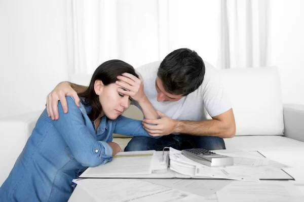 Young couple worried home in stress husband comforting wife in financial problems — Stock Photo, Image