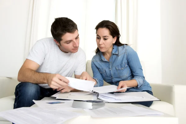 Young couple worried at home in stress accounting bank payments — Stock Photo, Image