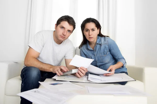 Young couple worried at home in stress accounting bank payments — Stock Photo, Image