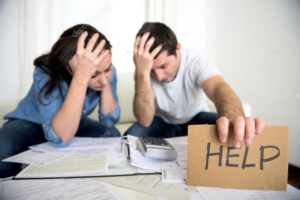 Young couple worried at home in bad financial situation stress asking for help