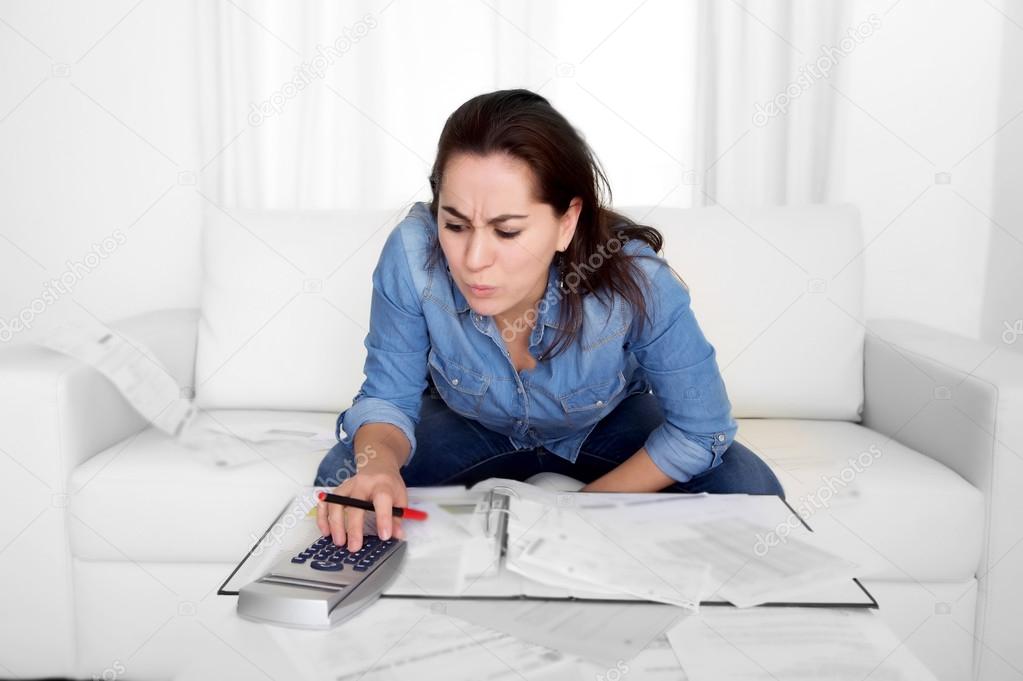 young woman worried at home in stress accounting desperate in financial problems