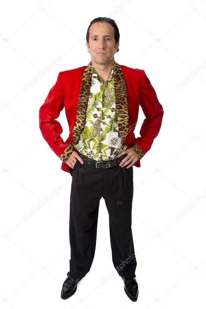 Funny rake playboy and bon vivant mature man wearing red casino jacket and Hawaiian shirt standing happy posing gigolo alike