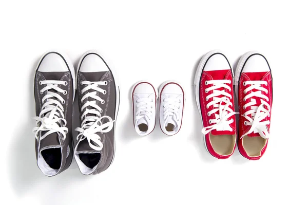 Shoes in father big, mother medium and son or daughter small kid size in family love concept — Stock Photo, Image