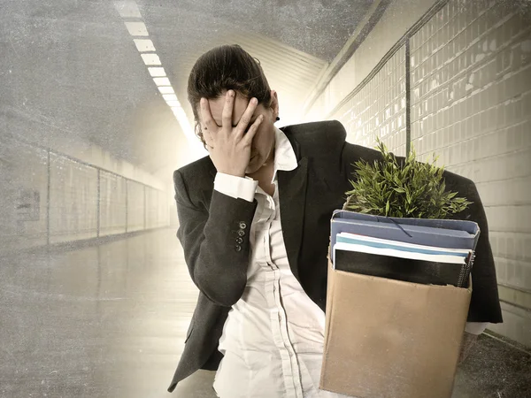 Sad depressed businesswoman carrying cardboard box fired from Job — Stock Photo, Image