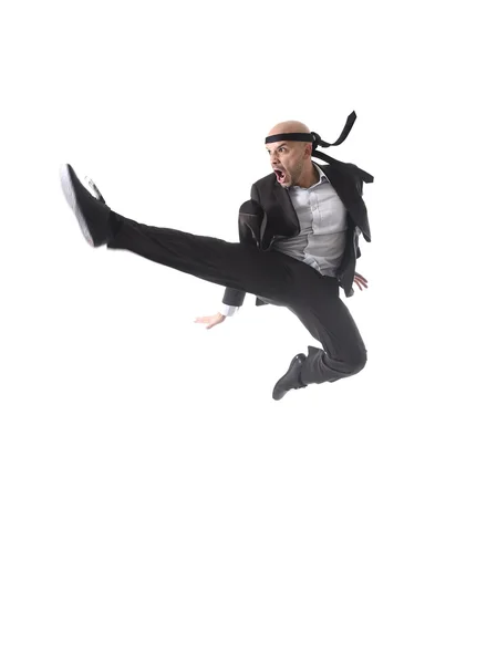 Funny aggressive businessman wearing suit jumping on the air in