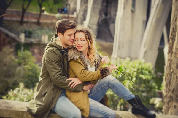 Young beautiful couple in love on street together celebrating Valentines day with Champagne toast — Stock Photo, Image