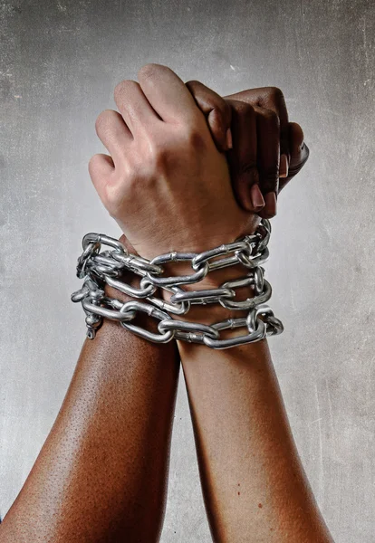 White race hand chain locked together with black ethnicity woman multiracial understanding — Stock Photo, Image