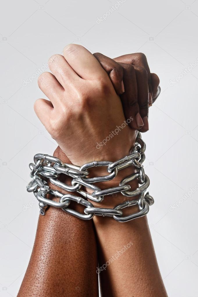 white race hand chain locked together with black ethnicity woman multiracial understanding