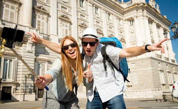 beautiful friends tourist couple visiting Spain in holidays students exchange taking selfie picture