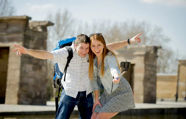 Young American student and tourist couple visiting Egyptian monument taking selfie photo with stick — Stock Photo, Image