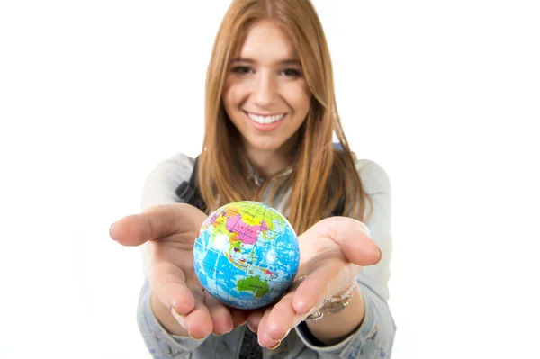 Beautiful student girl holding little world globe in her hand choosing holidays destination in travel tourism concept — Stock Photo, Image