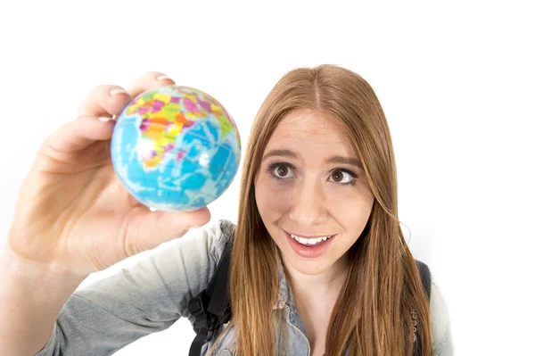 Beautiful student girl holding little world globe in her hand choosing holidays destination in travel tourism concept — Stock Photo, Image