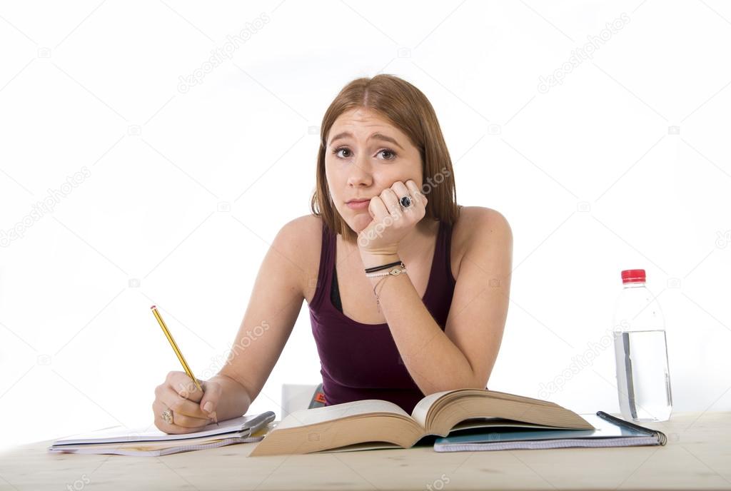 College student girl studying for university exam worried in stress feeling tired and test pressure