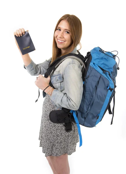 Happy young student tourist woman carrying backpack showing passport in tourism concept — Stock Photo, Image