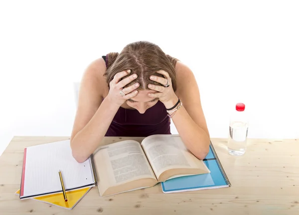concentrated college student girl studying for university exam in stress