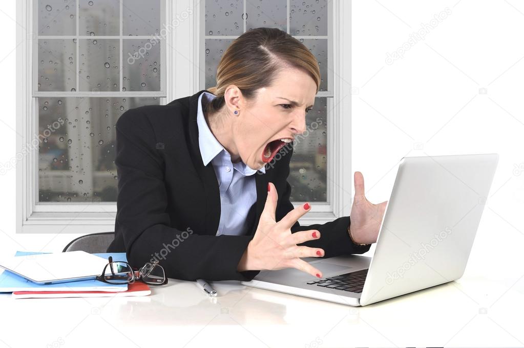 young businesswoman angry in stress at office working on computer