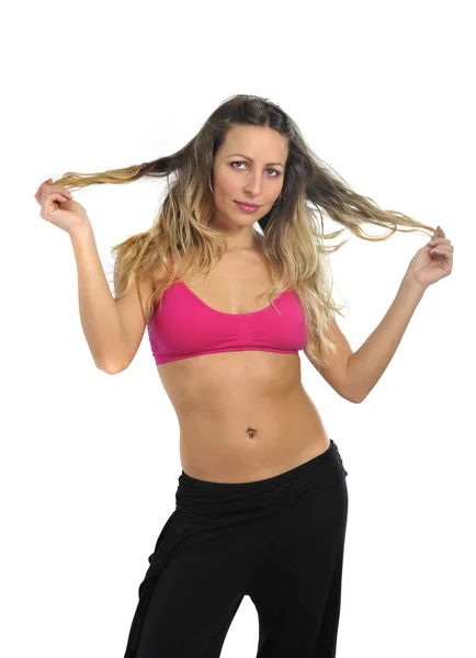 Giovane sexy bella donna in abiti sportivi in posa seducente con reggiseno superiore in concetto di fitness — Foto Stock