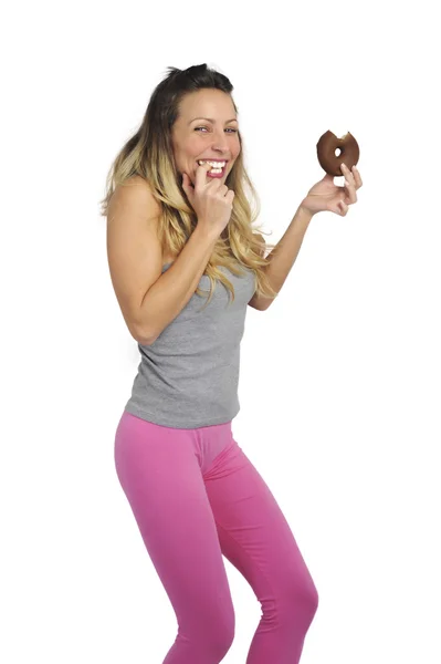 Young sexy naughty woman eating chocolate donut happy guilty for unhealthy nutrition — Stock Photo, Image