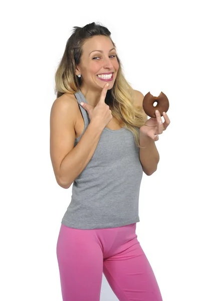 Young sexy naughty woman eating chocolate donut happy guilty for unhealthy nutrition — Stock Photo, Image