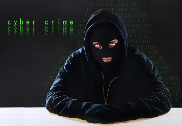 Hacking expert man in hood as sensitive information cracker cyber crime concept — Stock Photo, Image