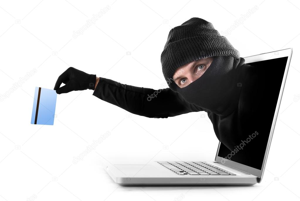 cyber criminal out of computer grabbing and stealing credit card cyber crime concept