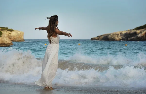 Woman looking thoughtful at sea water in summer holiday enjoying vacation relaxed wearing white beach dress — Stock Photo, Image