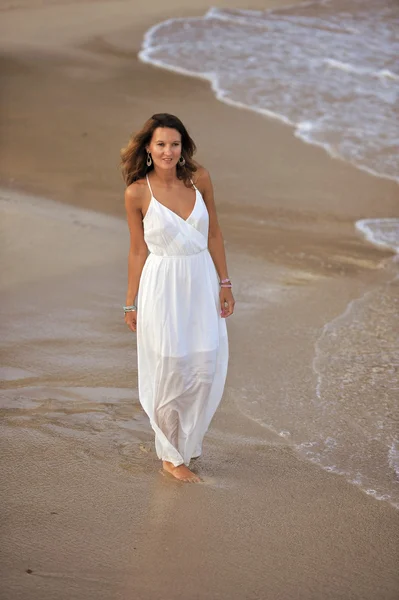 Attractive and beautiful woman enjoying vacation summer holidays at Spain coast village walking on beach — Φωτογραφία Αρχείου